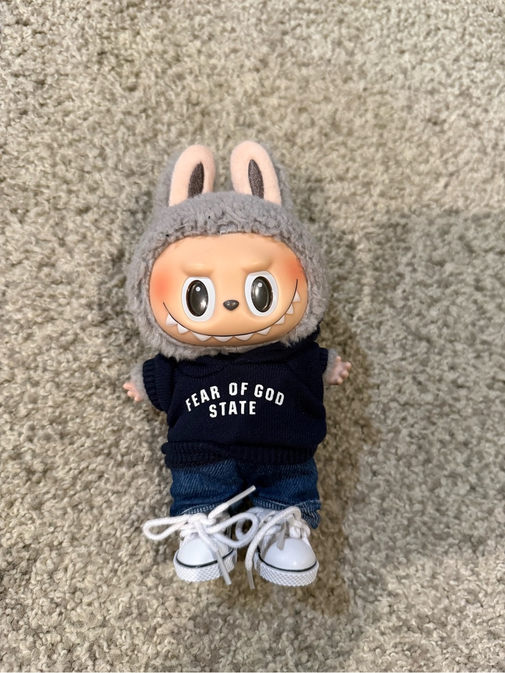 Sesame Bean Labubu with Fear of God outfit Authentic was on display